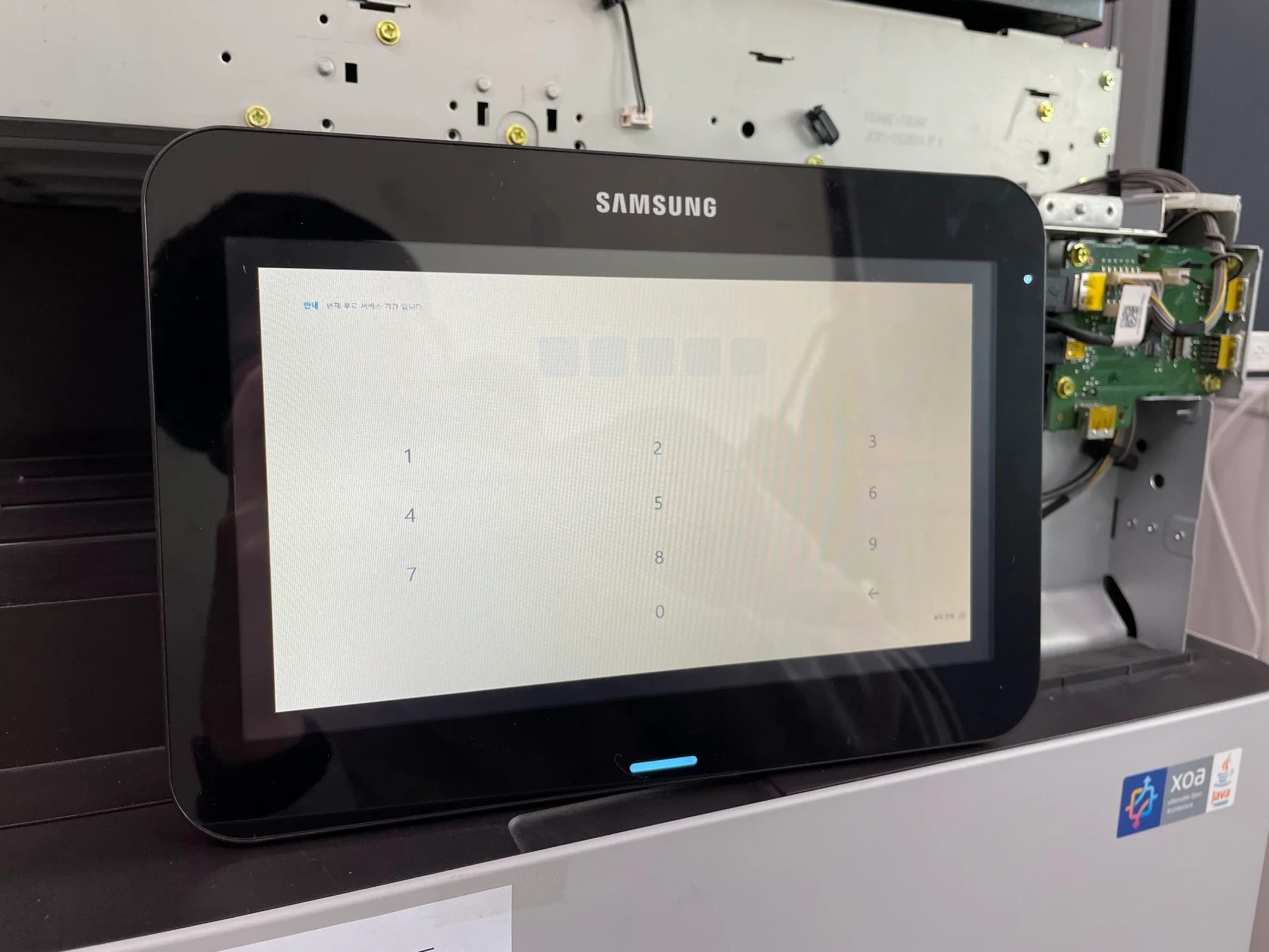 An authentication-code flow tested on the touch display connected to a multifunction printer.
